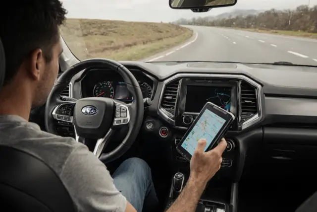 A driver accidentally knocks their tablet off the dashboard during a sharp turn. Instead of cracking, the device bounces off the floor and keeps working—that’s the power of rugged design